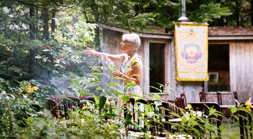 Anne standing in the garden