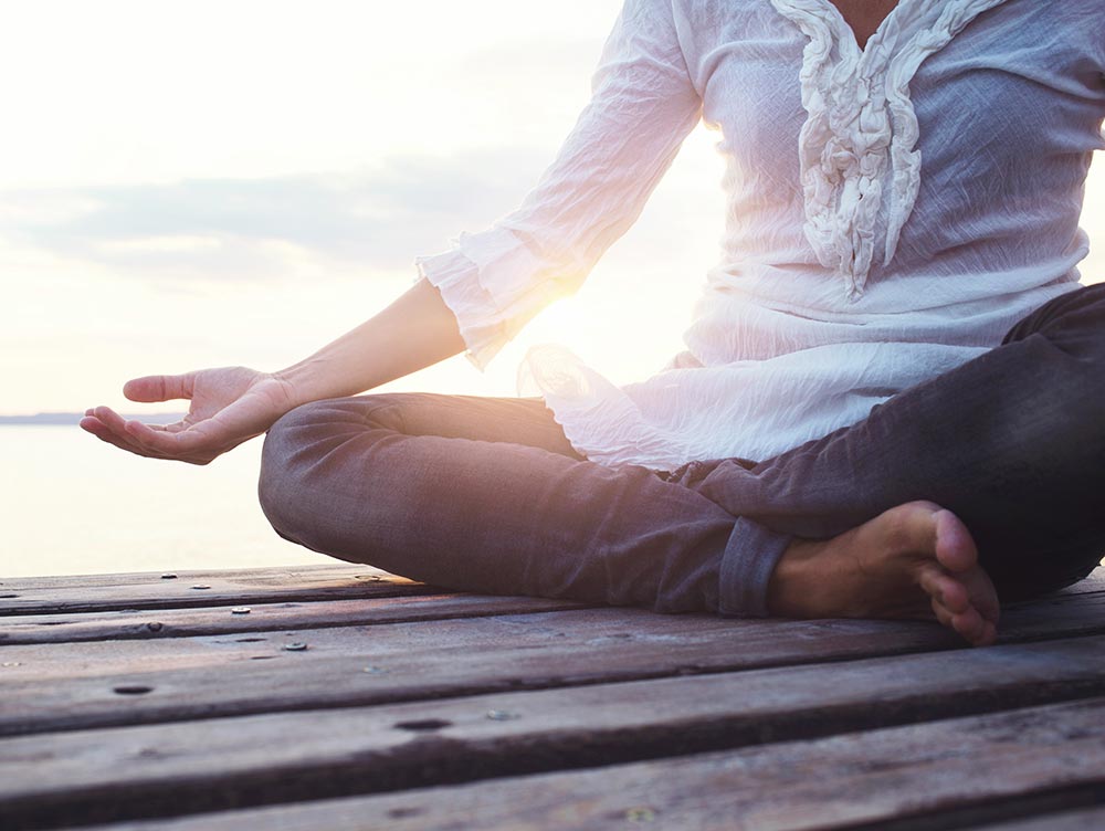 woman sitting on a dock